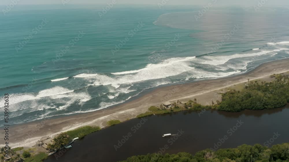 Tourist Boat Sailing Escapade Through The Mangrove River Near The Ocean Coast In El Paredon, Guatemala. - Drone Shot Tourist Boat Sailing Escapade Through The Mangrove River Near The Ocean Coast In El Paredon, Guatemala. - Drone Shot