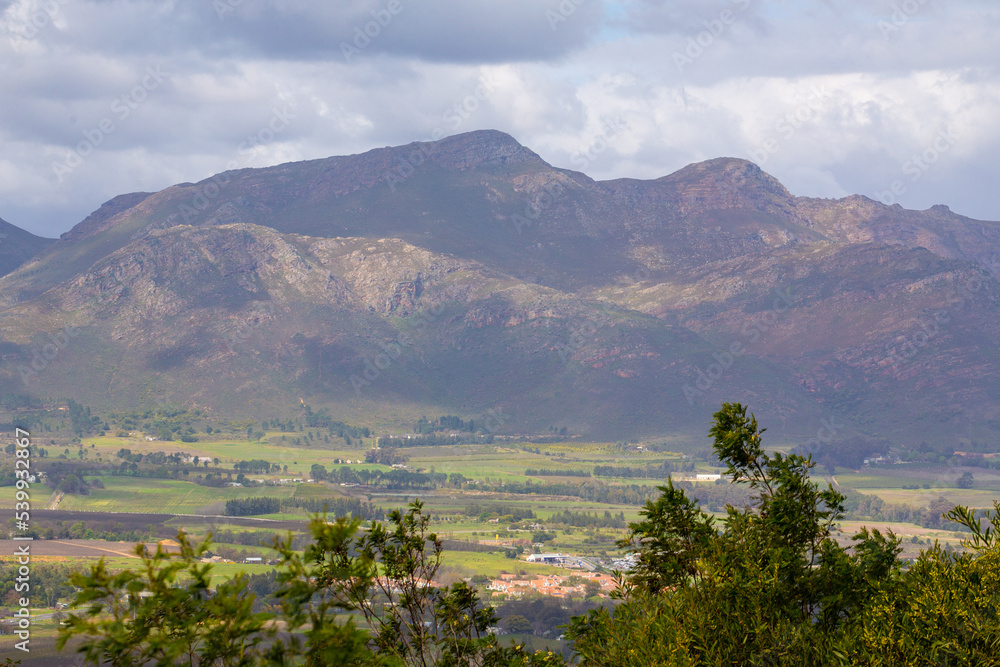 Landscape close to Paarl with Mountains and clouds in the background