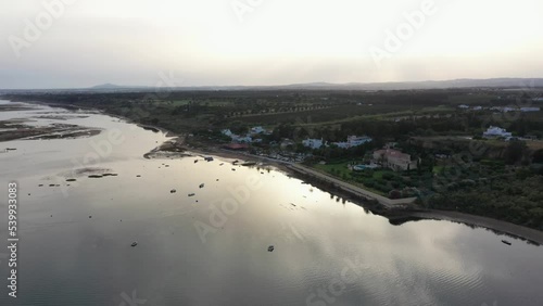 Aerial View Of Ria Formosa Lagoon At Low Tide With Holiday Home and Resort In Praia da Fabrica, Vila Nova de Cacela, Portugal.