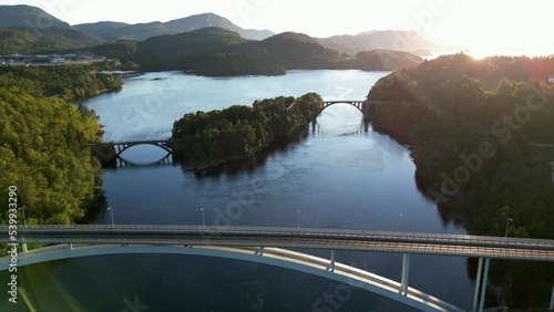 The Skodje bridges were officially opened in 1922. The two stone arches are a well-known landmark at Skodje in Ålesund municipality. Ahead we see the new Straumsbrua, which took over traffic in 2004. photo