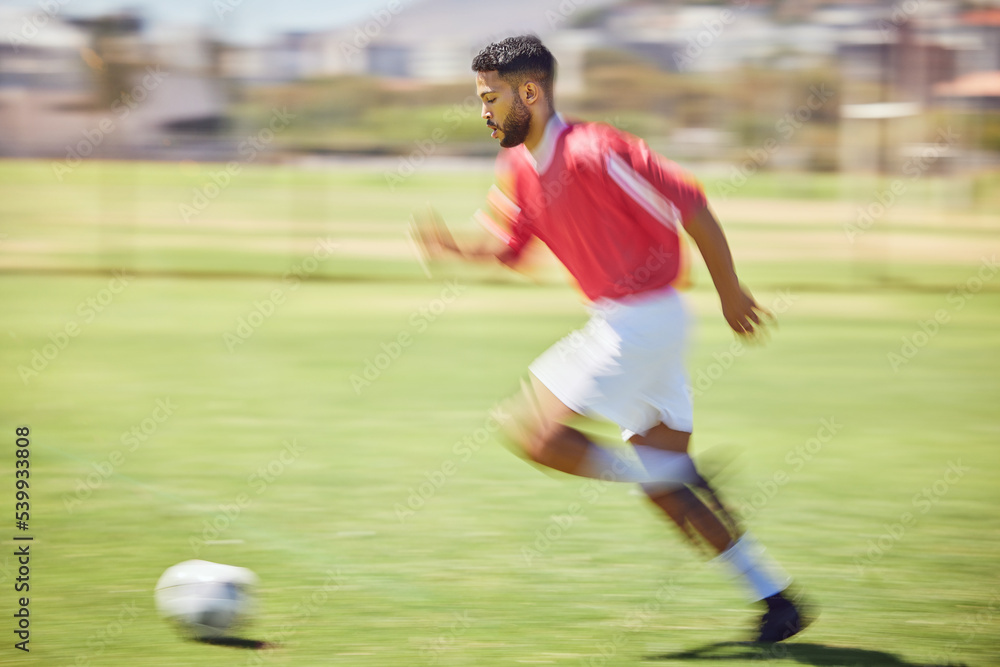 Soccer player, running and soccer ball man park training on grass pitch, sports competition or game, goals and winning score. Motion blur professional athlete, football field action or outdoor energy
