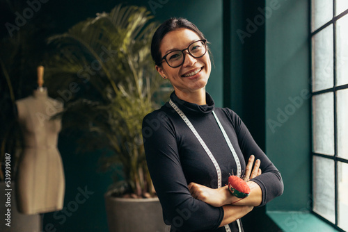Young female designer smiling at camera photo