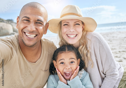 Selfie, beach and portrait of a happy family on vacation together in nature by the ocean. Happy, smile and parents with their girl child taking photo while relaxing at seaside on holiday or adventure