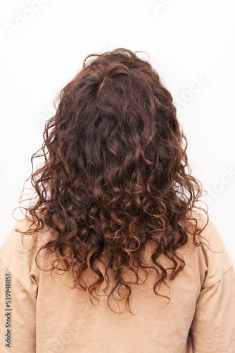 Natural curls with coloring Moisturized healthy curly hair after visiting the salon. Curly method product used