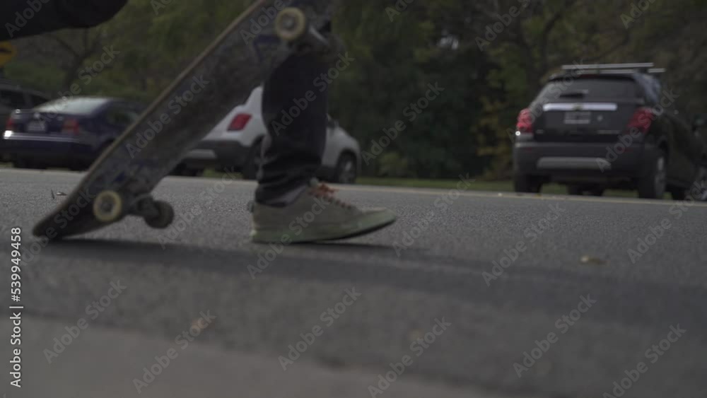 Man launches skateboard on the asphalt and start riding. Slow motion footage at sunset. Man launches skateboard on the asphalt and start riding. Slow motion footage at sunset.