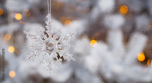 Winter snow background abstract bokeh. Snowflake Close-Up. Free space for text.