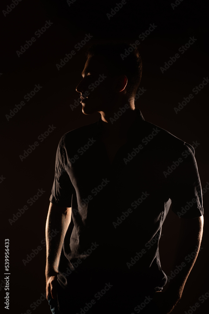 Fototapeta premium Silhouette of a man in the studio