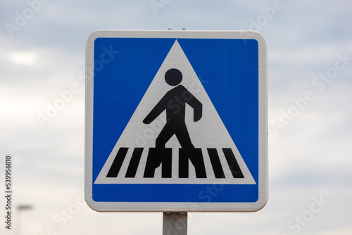 Road Sign: Blue pedestrian crossing sign