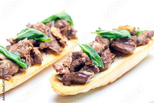 roasted livers on toasted baguette with sage leaves