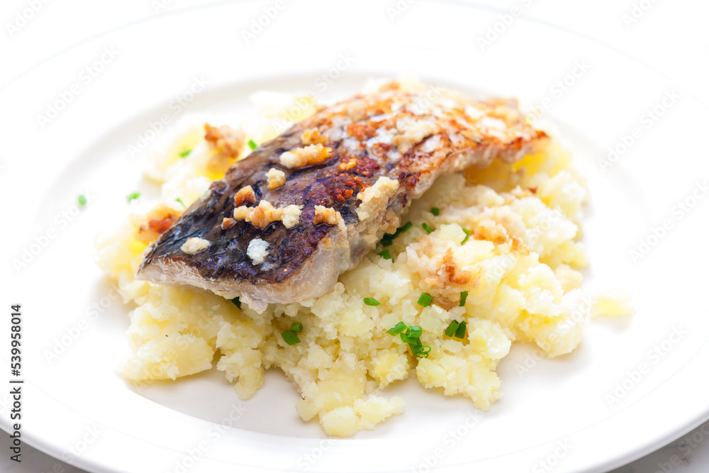 grilled carp with garlic served with mashed potatoes