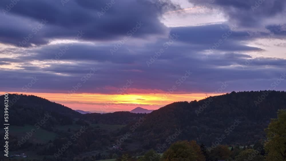 The setting sun illuminates the beautiful autumn forest mountain landscape. Autumn colors of nature The setting sun illuminates the beautiful autumn forest mountain landscape. Autumn colors of nature