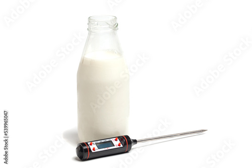 milk bottle with thermometer isolated on white