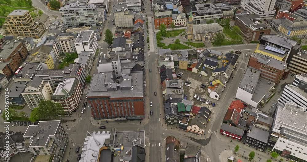 Tromsø Norway Aerial v20 birds eye view drone fly along storgata main street across downtown city capturing street activities around harbor town in tromsøya island - Shot with Mavic 3 Cine - June 2022 Tromsø Norway Aerial v20 birds eye view drone fly along storgata main street across downtown city capturing street activities around harbor town in tromsøya island - Shot with Mavic 3 Cine - June 2022