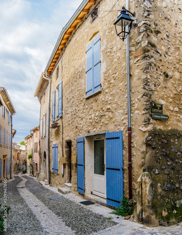 Medieval houses and cobblestone street in the village of Rochemaure, in the South of France (Ardeche) Medieval houses and cobblestone street in the village of Rochemaure, in the South of France (Ardeche)
