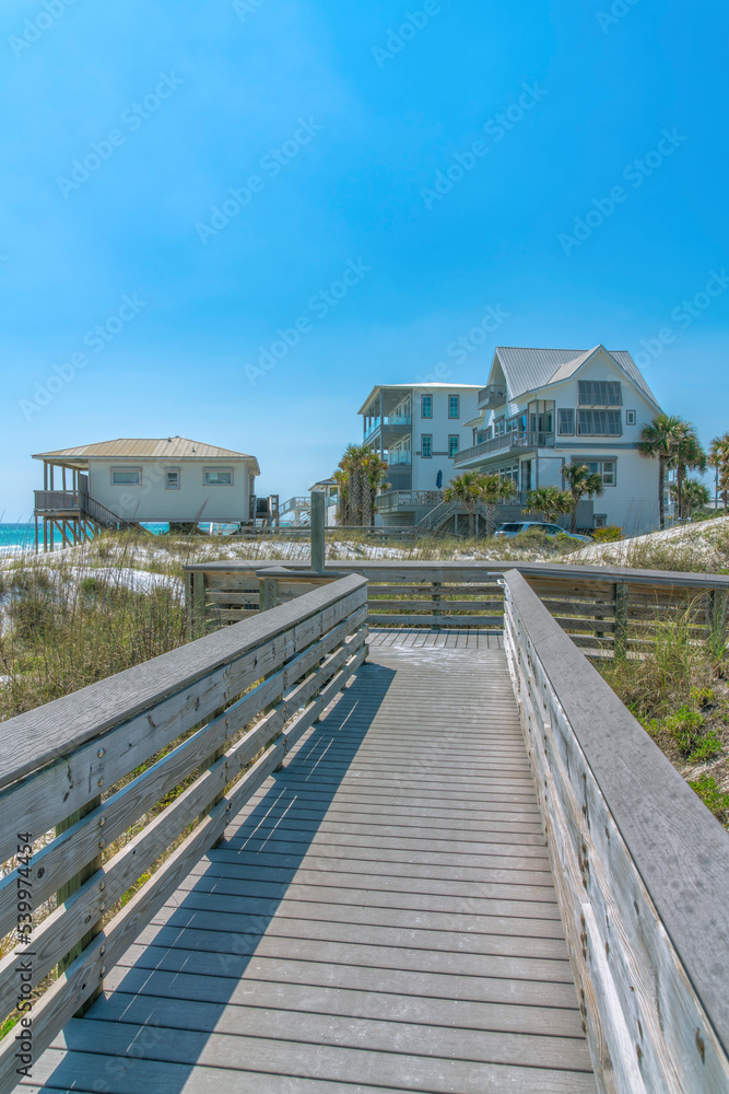 Destin, Florida beach- View of beach houses from a wooden boardwalk