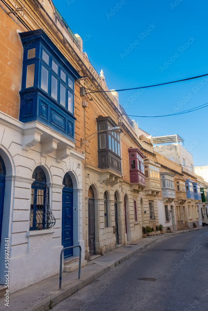 Typical maltese colorful balconies in a street of Sliema,  Malta