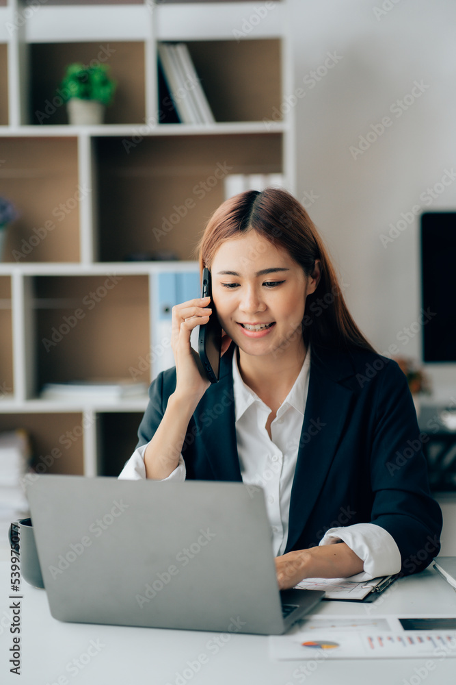 Happy excited young Asian woman with a laptop at home sitting in-home office, Emotional girl feeling glad and happy Happy excited young Asian woman with a laptop at home sitting in-home office, Emotional girl feeling glad and happy