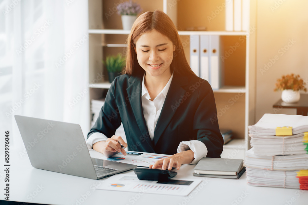 Happy excited young Asian woman with a laptop at home sitting in-home office, Emotional girl feeling glad and happy Happy excited young Asian woman with a laptop at home sitting in-home office, Emotional girl feeling glad and happy