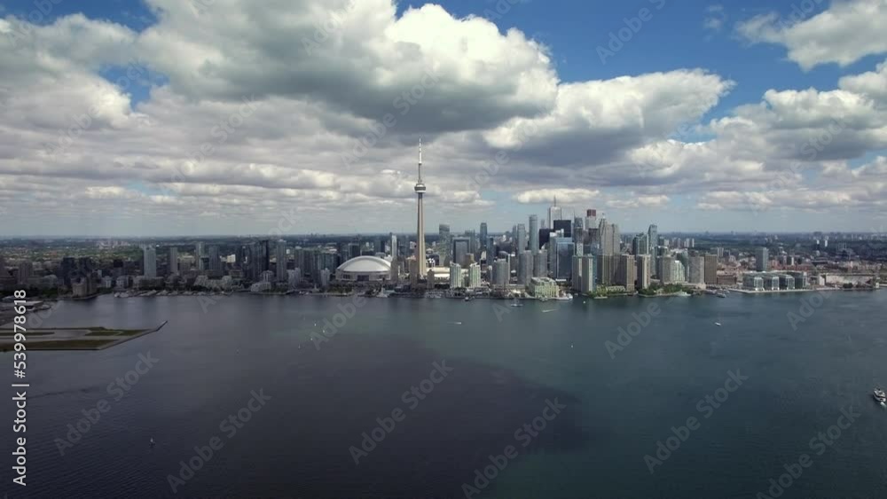 Aerial establishing shot of Toronto skyline and Lake Ontario by day in Toronto, Ontario, Canada. Aerial establishing shot of Toronto skyline and Lake Ontario by day in Toronto, Ontario, Canada.