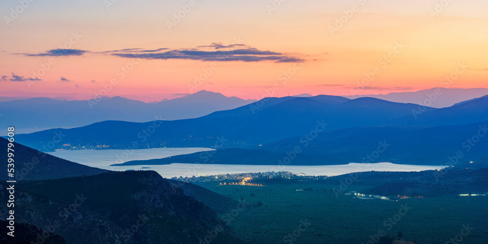 View over the Pleistos River Valley towards the Gulf of Corinth at dusk, Delphi, Phocis View over the Pleistos River Valley towards the Gulf of Corinth at dusk, Delphi, Phocis