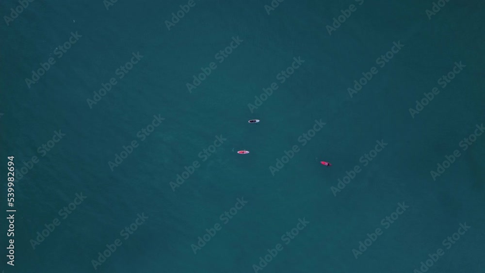 4k Top view of ships float on water outdoors irrl. Aerial pic of three small boats moving on calm turquoise waters outdoors in summer. Creative operator launched drone and captured magnificent picture 4k Top view of ships float on water outdoors irrl. Aerial pic of three small boats moving on calm turquoise waters outdoors in summer. Creative operator launched drone and captured magnificent picture