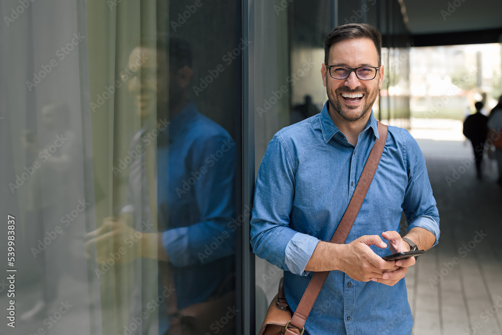 Portrait of delighted entrepreneur businessman, smiling for the camera, outdoors. Portrait of delighted entrepreneur businessman, smiling for the camera, outdoors.