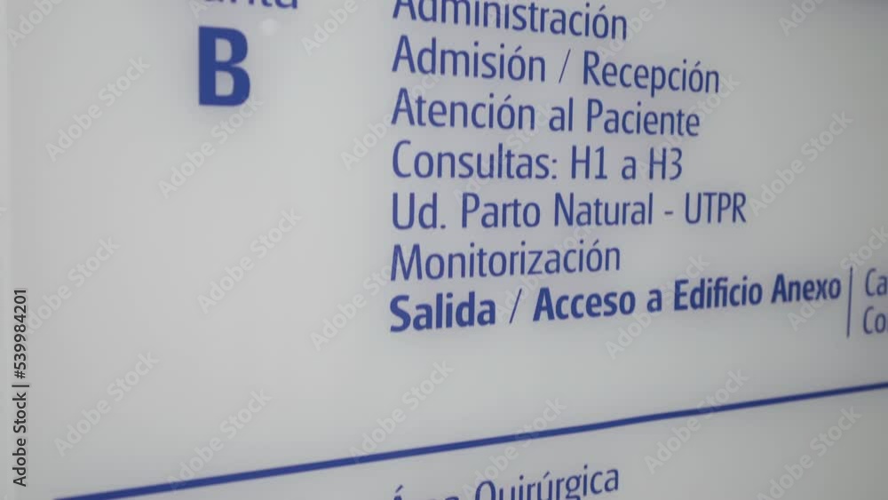 floor signal inside a clinic private hospital written in Spanish on white board floor signal inside a clinic private hospital written in Spanish on white board
