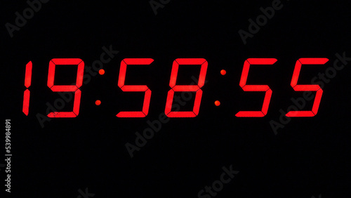 Obraz na płótnie Digital timer on a black background. Light panel with red numbers w salonie