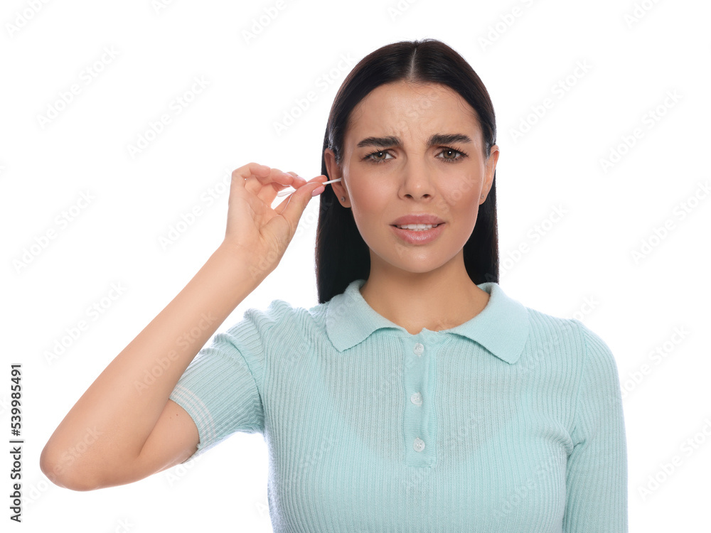 Young woman cleaning ear with cotton swab on white background Young woman cleaning ear with cotton swab on white background