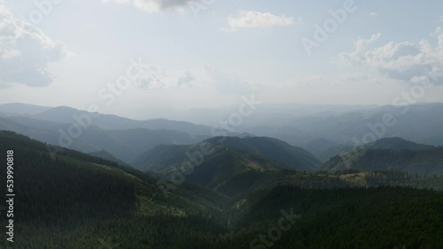 Aerial view of the Carpathian Mountains in Romania. Transalpina, Transfagarasan, summer, green trees, drone, highlands, scenery, valleys. 4K 50fps Drone Video Footage