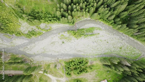 Aerial view of the Lot River in Romania. Carpathian Mountains, transalpina, summer, green trees, drone, highlands, scenery, valley watermountain stream. 4K Drone Video Footage photo