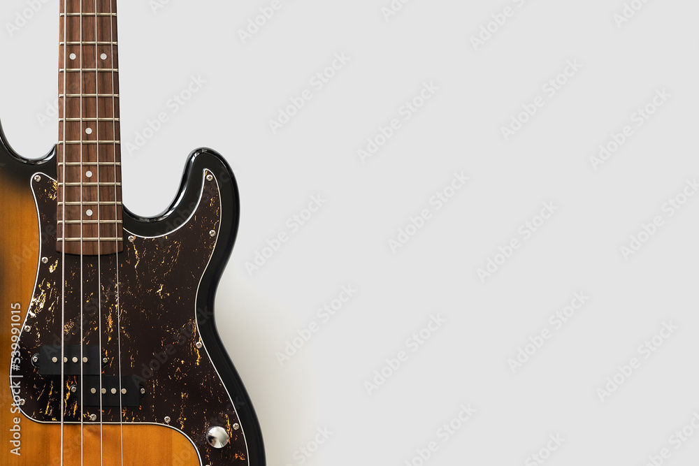 Obraz premium Old bass guitar on white background. Vintgae music wallpaper