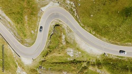 Aerial view of the Transalpina road in Romania. Carpathian Mountains, curvy road, summer, green trees, drone, highlands, scenery, road trip, highway, valleys. 4K 50fps Drone Video Footage