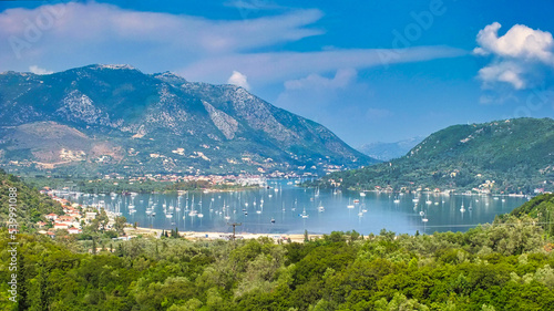 A color photo over looking a harbor in the Greek Isles.