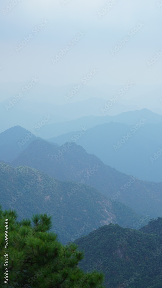 The beautiful mountains landscapes with the green forest and the erupted rock cliff as background in the countryside of the China