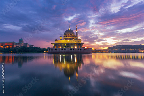 Photography Beautiful sunrise At Putra Mosque, Putrajaya Malaysia with colorful clouds and reflection on the lake surface