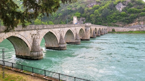Beautiful shot of the historical Mehmed Pasa Sokolovic Bridge over the Drina river in Visegrad photo