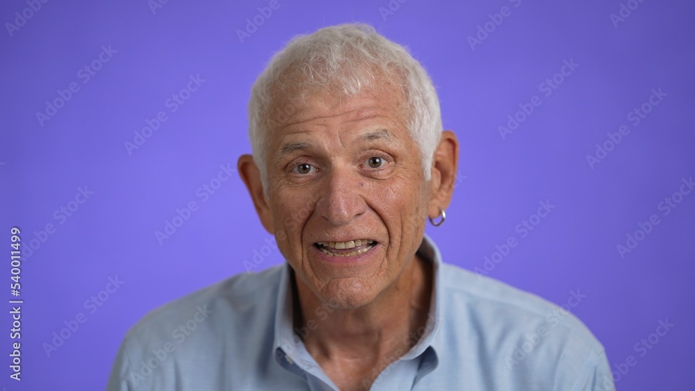 Closeup portrait of a smiling handsome middle aged man 70s. Mature caucasian man showing real emotions being happy, confident and likable. Closeup portrait of a smiling handsome middle aged man 70s. Mature caucasian man showing real emotions being happy, confident and likable.