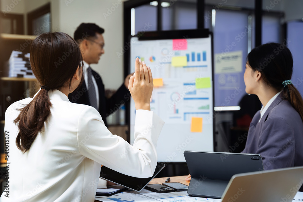Fototapeta premium Group of Young Asian business team creative businesspeople coworker in office. Meeting Presentation for analysis graph company financial. People Work in Business Office.