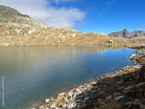 A crystal clear alpine lakes Laghi d'Orsirora during a beautiful autumn day in the mountainous area of the St. Gotthard Pass (Gotthardpass), Airolo - Canton of Ticino (Tessin), Switzerland (Schweiz)