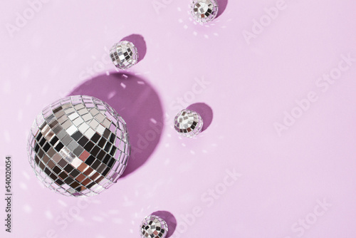  Beautiful disco balls on a lilac background. Modern postcard with space for text