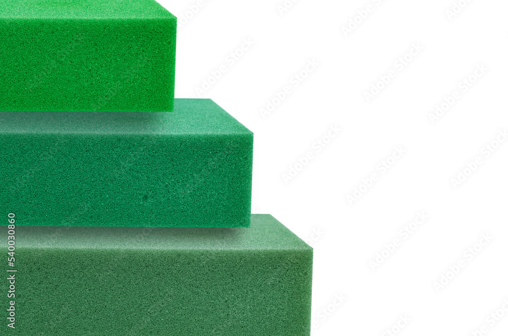 stack of green thick sponge foam square pieces with copy space Stock