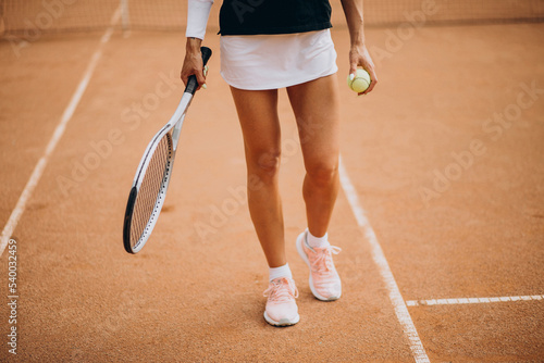 Female tennis player at the tennis court © Petro