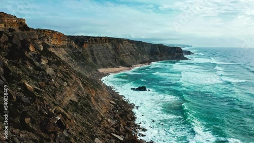 Wallpaper Mural Drone is flying along to  rocky Atlantic ocean coastline, Portugal. Summer. Cloudy sky. Beautiful aerial view natural landscape with ocean rocky shore.  Scenic tourist travel destination. No people Torontodigital.ca