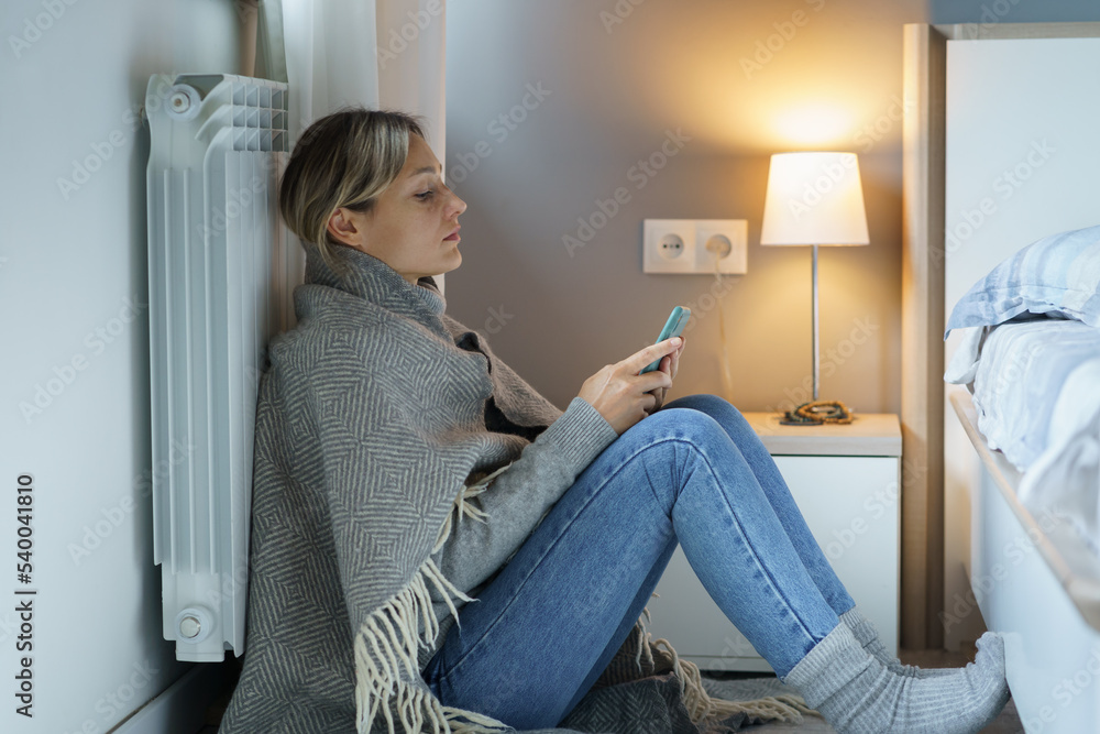 Tired young woman covered with warm blanket searches Internet looking for job to have opportunity to pay bills. Pensive female leaning back on battery wants to prevent bankruptcy trying to find job Tired young woman covered with warm blanket searches Internet looking for job to have opportunity to pay bills. Pensive female leaning back on battery wants to prevent bankruptcy trying to find job