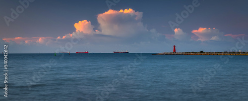 Bastic Sea in Nowy Port withe the red lighthouse at sunset, Gdansk.