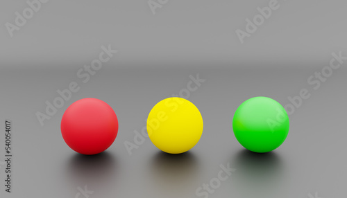 3d-rendering of three balls in the colours red, yellow and green as a symbol for the colours of a traffic light