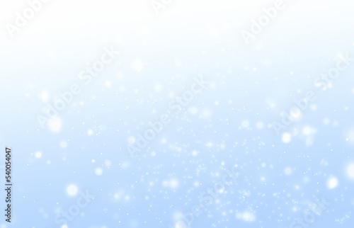 blurry snowflakes on a blue background. Abstract winter background © Алена Ягупа
