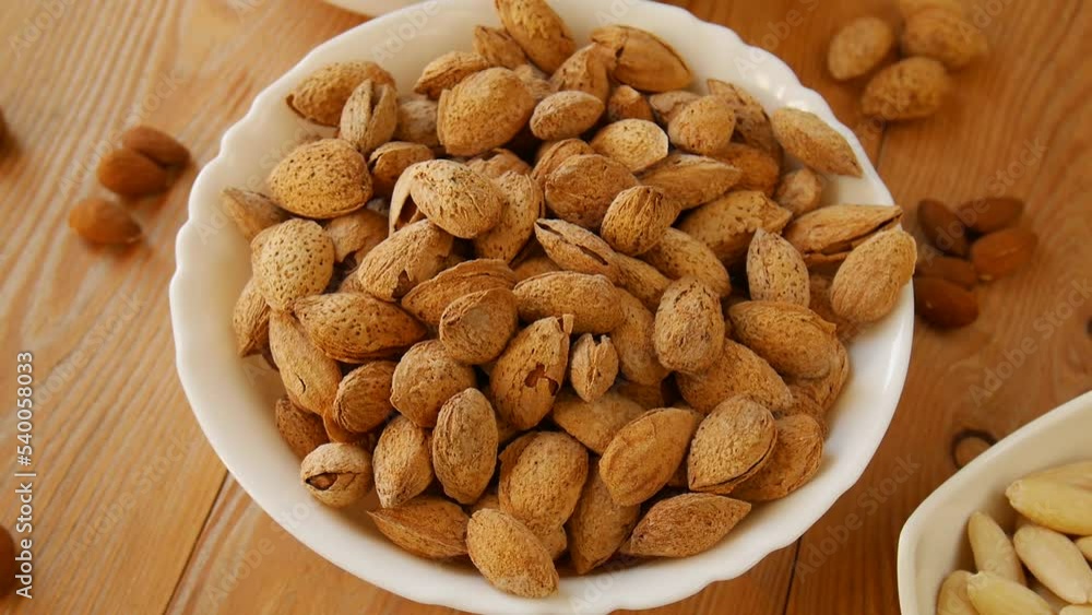 Roasted salted almonds on a plate. Roasted salted almonds on a plate.