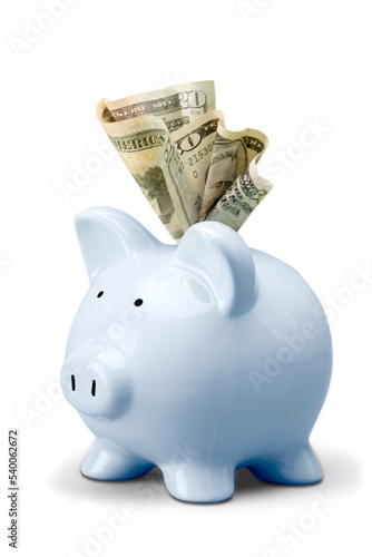 Piggy bank and several euro banknotes on white background
